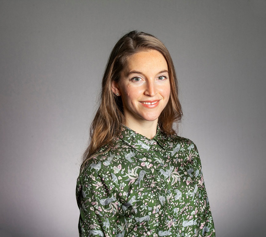 Camilla Nord headshot wearing green paisley shirt