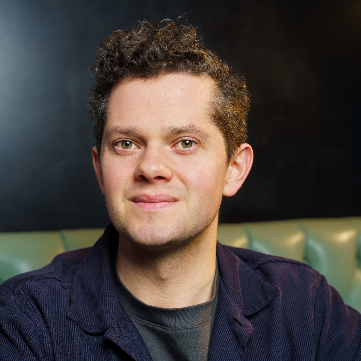 Headshot of James Way wearing t shirt and jacket