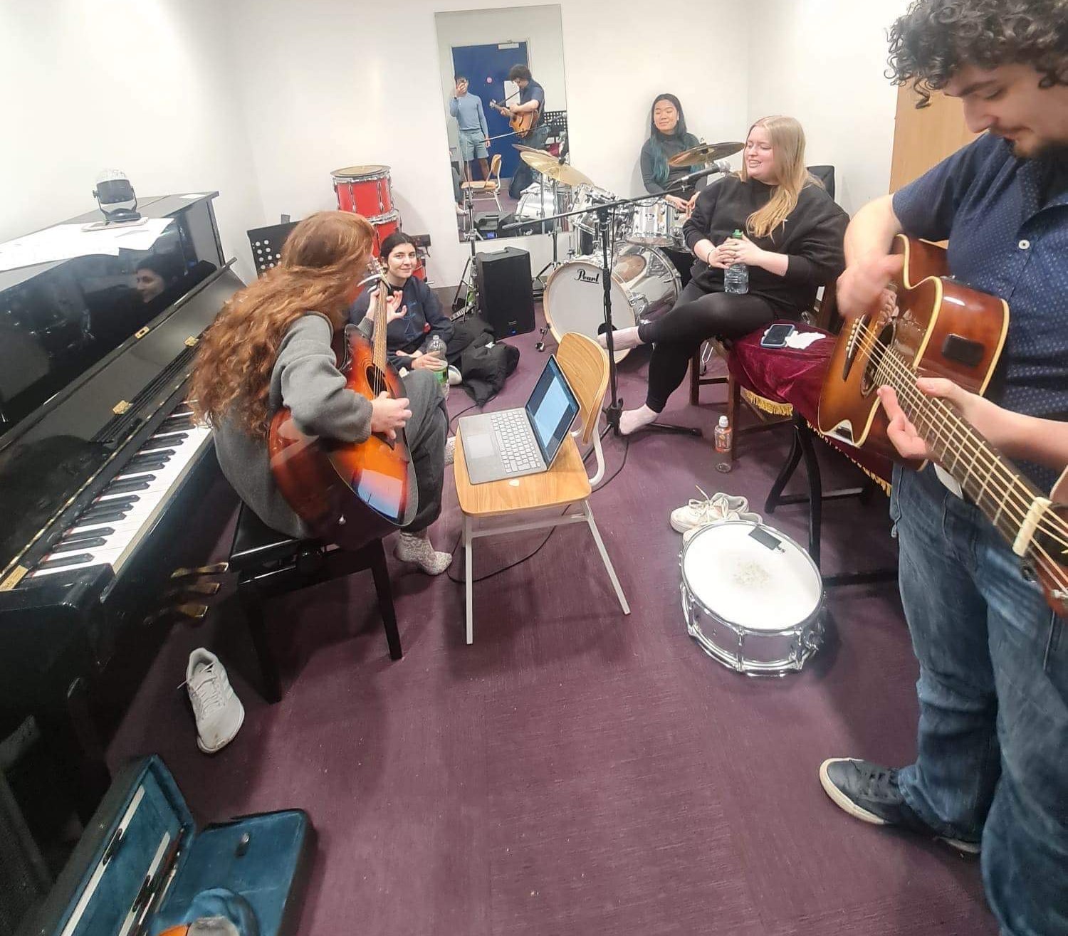 Pop group rehearsing
