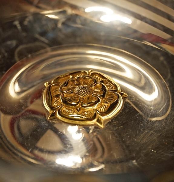 Close up of Rose crest on College silver 